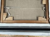 two pictures of a weaving machine with a wooden frame