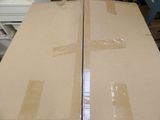 two boxes sitting on top of each other on a table