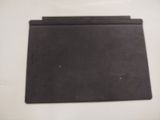 a piece of black paper on a white table