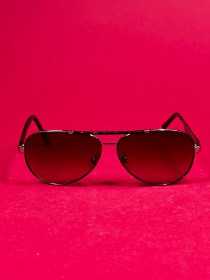 a pair of sunglasses on a pink background