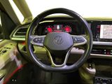the interior of a car with a steering wheel and dashboard controls