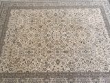 an image of a large oriental rug on a wooden floor