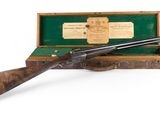 an old gun in a wooden case with a label on it