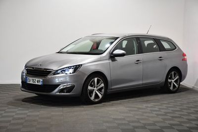 the silver car is parked in a room with a checkered floor