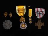 several medals are displayed on a black surface with a black background