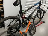 two bikes that are sitting next to each other on the floor