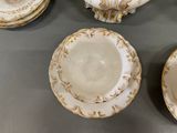 many plates and cups that are on the table