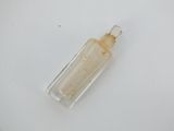 a small bottle with a liquid inside of it