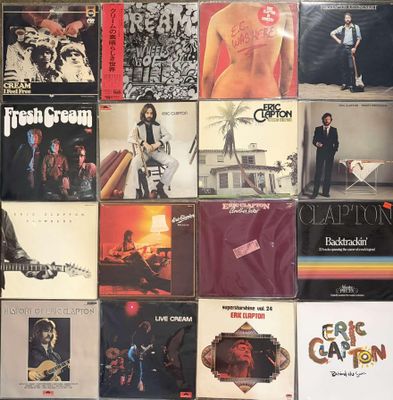 a lot of records on the wall of a room