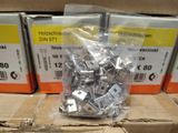 a bunch of metal clips in a package on a table