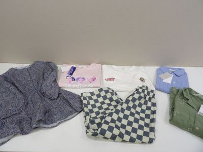 a lot of clothes that are on a table