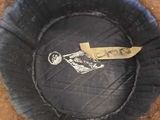 a picture of a hat with a tag on it