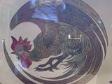 a picture of a rooster on display in a glass case