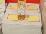 a bottle of wine sitting on top of a stack of boxes