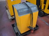 a yellow machine that is sitting on a pallet