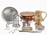 a lot of silver and gold items on a white surface