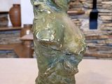 a statue of a dog that is sitting on a table