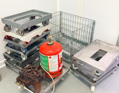 a fire extinguisor and a stack of crates in a room