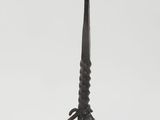 a close up of a metal candle holder on a white background