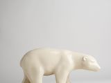 a white polar bear figurine on a white surface