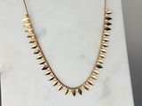 le collier à pointes en or