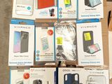 several boxes of cell phones are stacked on top of each other
