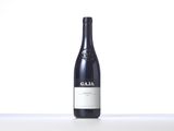 a bottle of wine that is sitting on a table