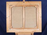 an old wooden easel with two doors open on a blue background