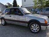 a silver car that is parked in a parking lot