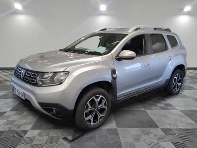 a picture of a silver dacia parked on a checkered floor