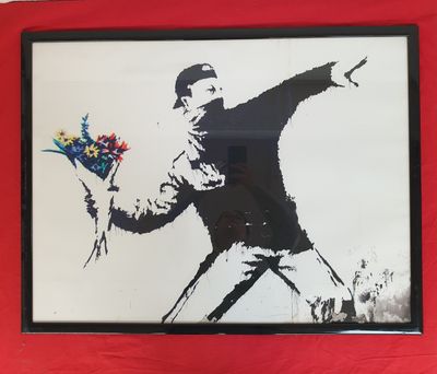 painting of a man throwing a bouquet of flowers in a red frame