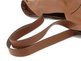 leather handbag on a white background with a strap around it