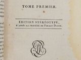 an old book with a picture of a woman on it
