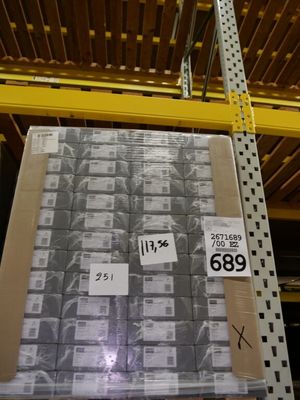 a pallet with a lot of boxes on it in a warehouse