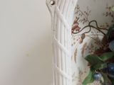 a white basket with a bunch of blue berries in it