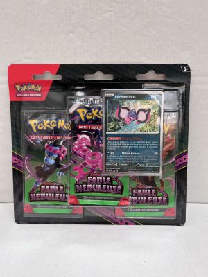 a close up of a box of pokemon cards on a white surface