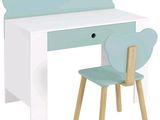 a desk with a chair and a desk top with a teddy bear on it