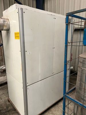 a white refrigerator and a blue cart in a warehouse