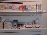 a display of cosmetics products on a shelf in a store