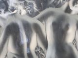 a glass sculpture of a naked woman in a glass bowl