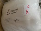 a white pillow in a box with a price tag on it