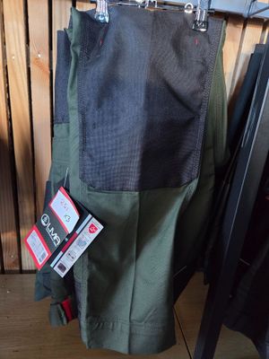 a pair of pants hanging on a hanger in a room