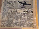 a newspaper with a picture of a plane on it