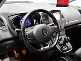 the interior of a car with a steering wheel and dashboard controls