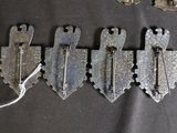 five old metal latches and a pair of scissors on a black cloth