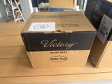 two boxes of wine sitting on a wooden table