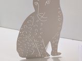 a paper cut of a cat sitting on a table