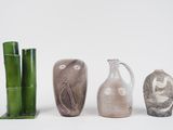 three vases that are next to each other on a table