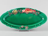 an image of a green plate with a fish on it