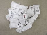 a pile of white bags of food on a table